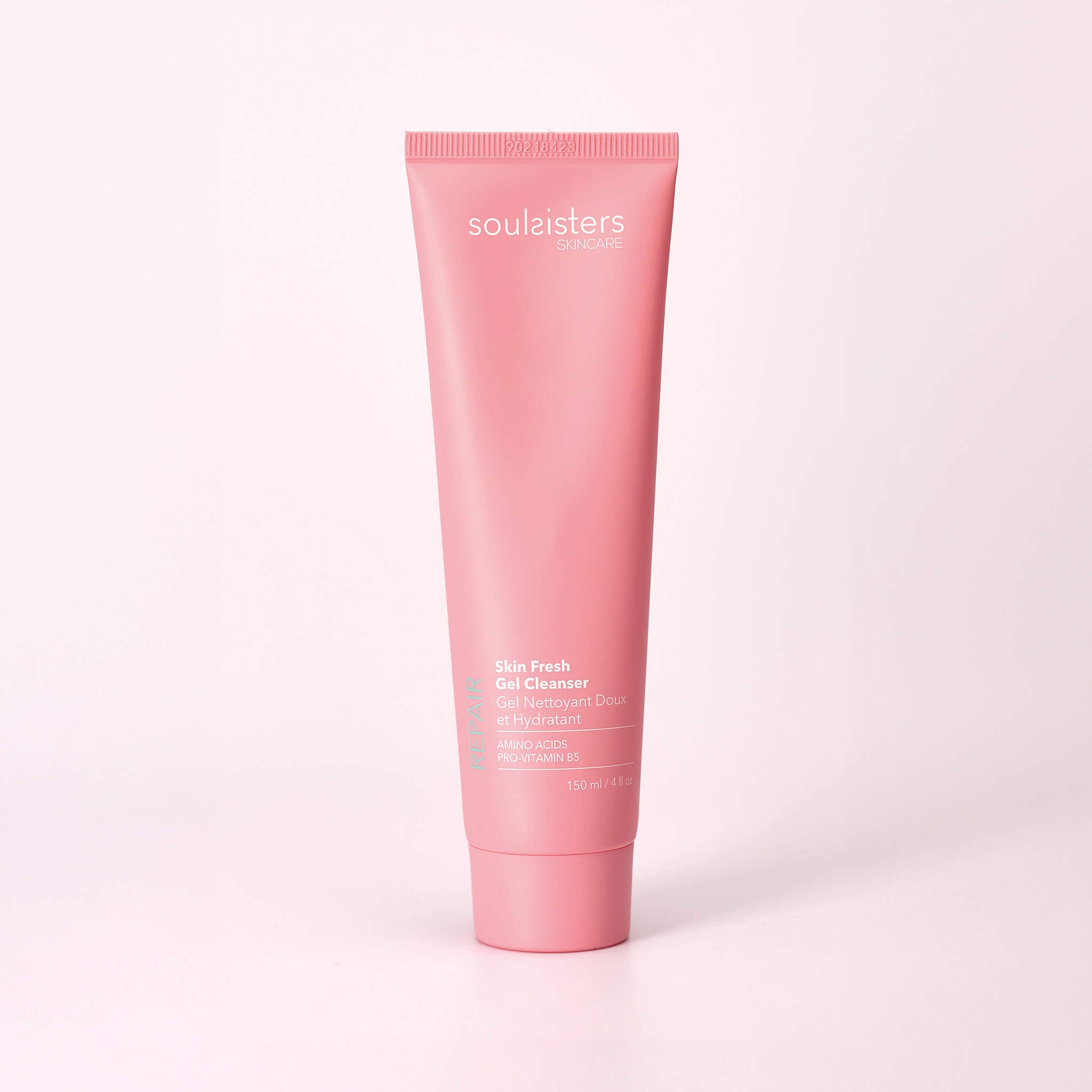 A tube of Soul Sisters Skincare's Skin Fresh Gel Cleanser is shown standing upright in a clean, studio setting. The tube is a soft, matte pink with a light green and white label that highlights the ingredients Amino Acids and Provitamin B5. The tube contains 50 ml or 1.7 fl. oz of product.